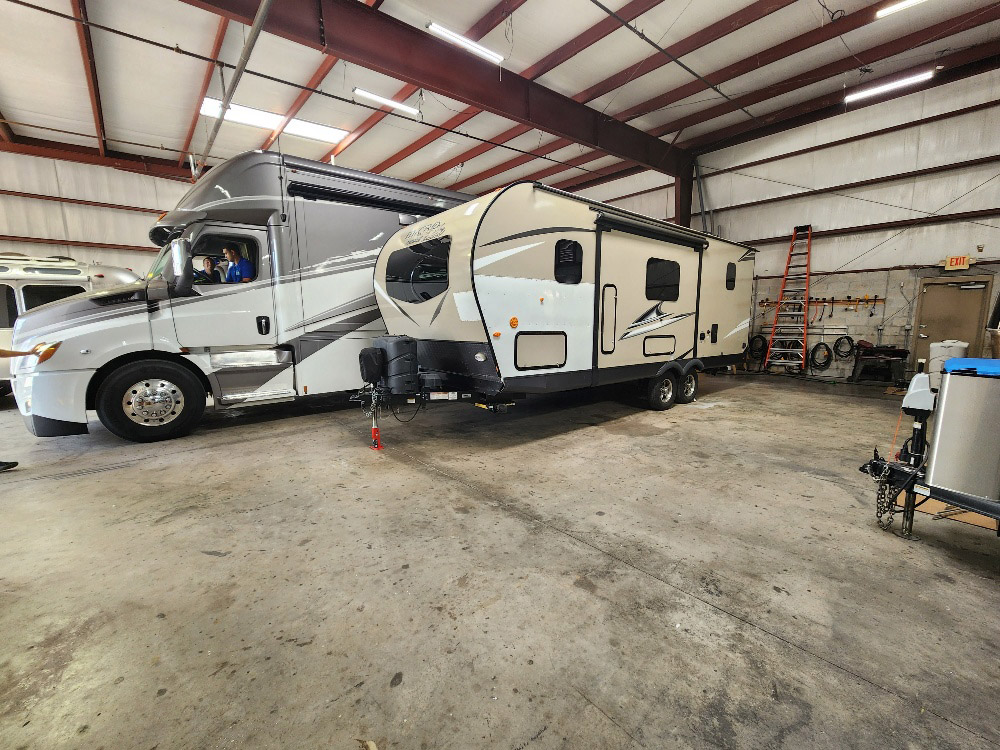 RVs parked in the RV collision repair center at KA RV