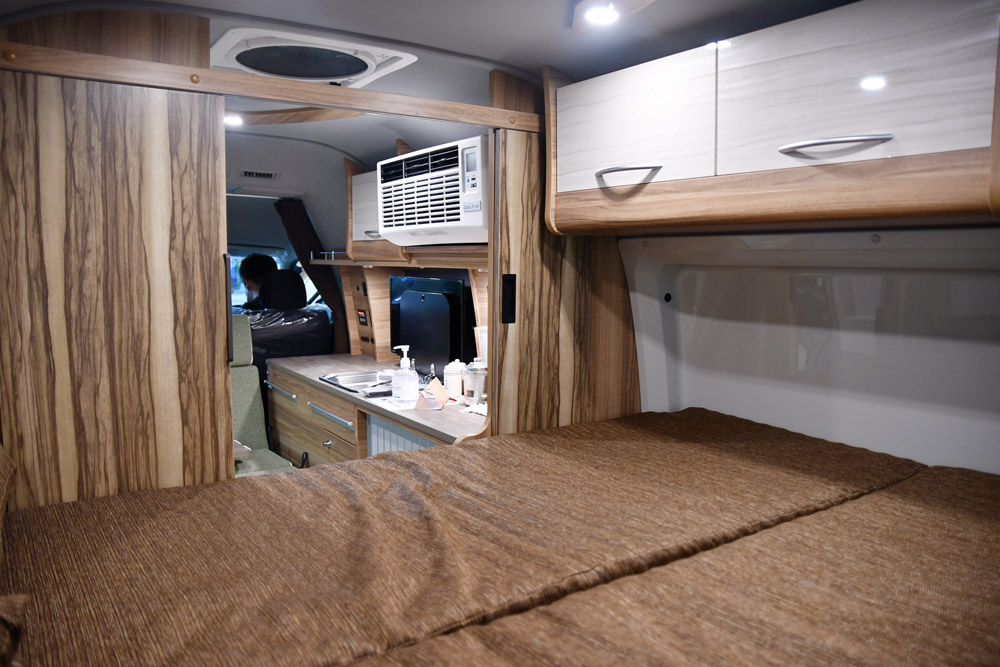 The interior of a camper van, along with it's RV A/C unit