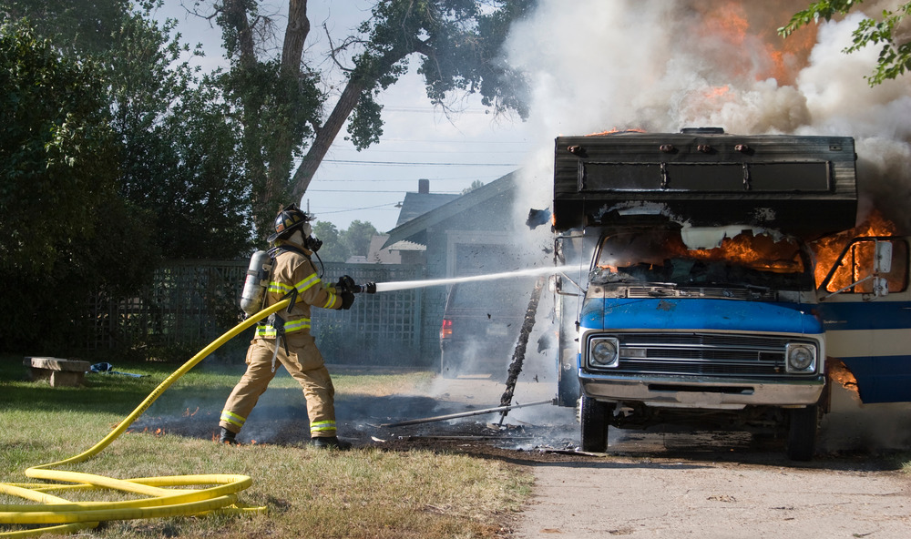 Firefighter battles RV fire
